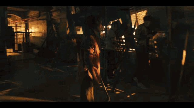 a woman stands in a dark room and says " pick them up we have to protect this place "