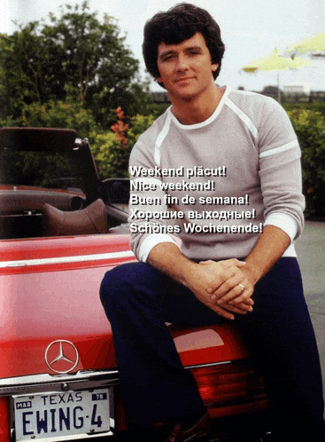 a man is sitting on a red mercedes with a texas license plate