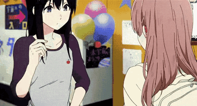 a couple of anime girls are standing next to each other in a room with balloons on the wall .