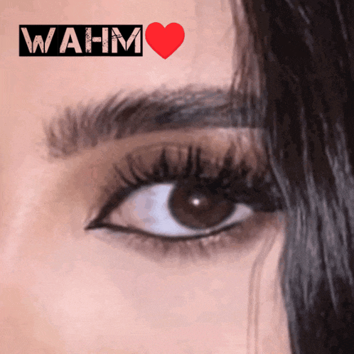 a close up of a woman 's eye with wahm written on the bottom