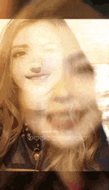 a woman 's face is being loaded with hearts