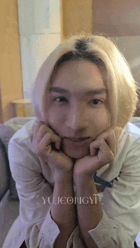 a close up of a person 's face with the name yujeongyi written on the bottom