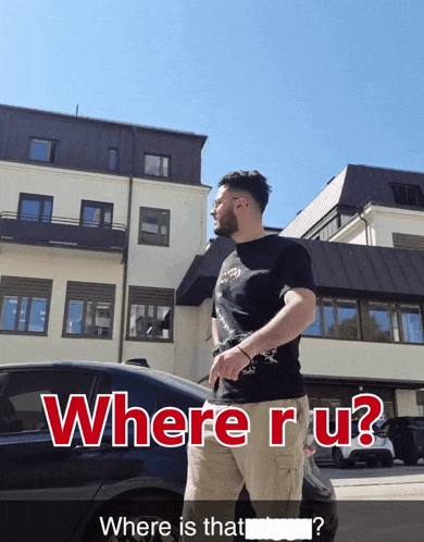 a man standing in front of a building with the words " where r u " written in red