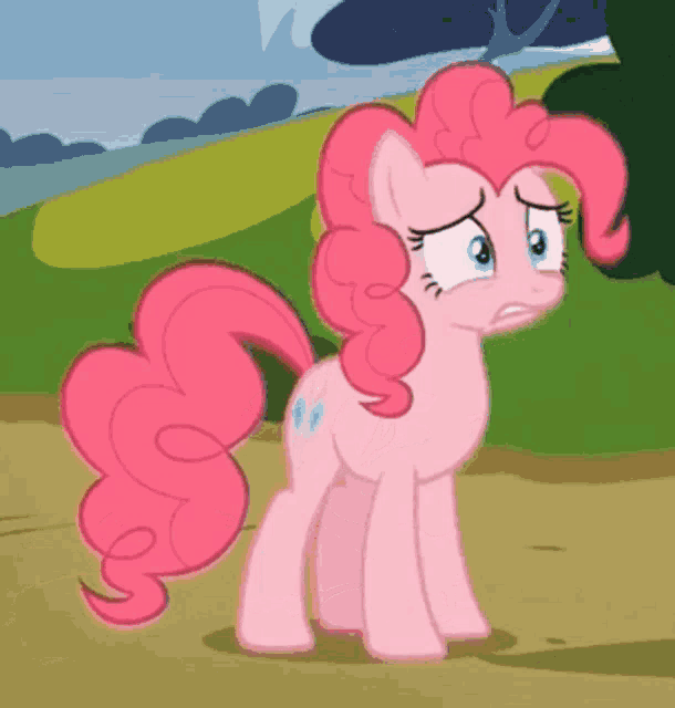 pinkie pie from my little pony is standing on a dirt path with a sad look on her face