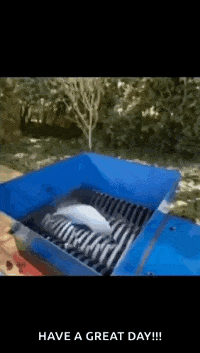 a blue box with a white object inside of it and the words have a great day