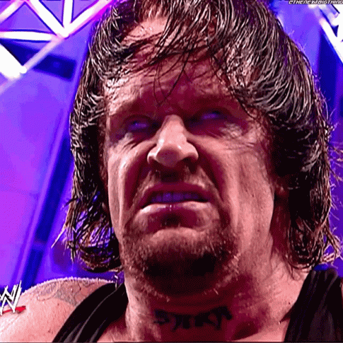 The Undertaker Tongue Out GIF - The Undertaker Tongue Out Rolls Eyes GIFs