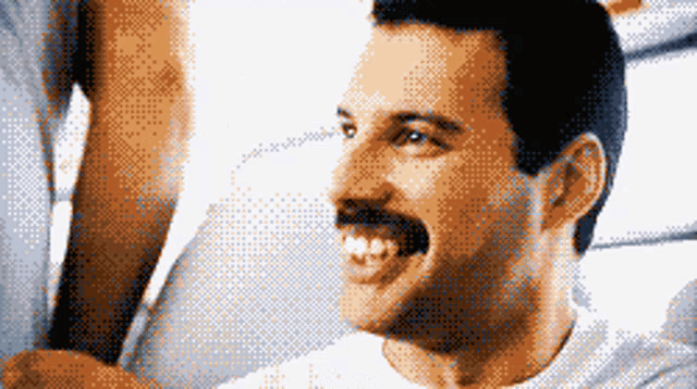 a pixelated image of a man with a mustache is smiling