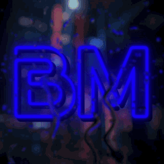 a neon sign that says bm is lit up in the dark