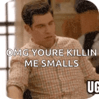 a man in a plaid shirt is saying `` omg youre killin me smalls '' while sitting at a table .