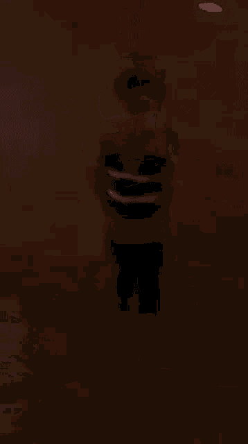 a blurry picture of a person standing in the dark