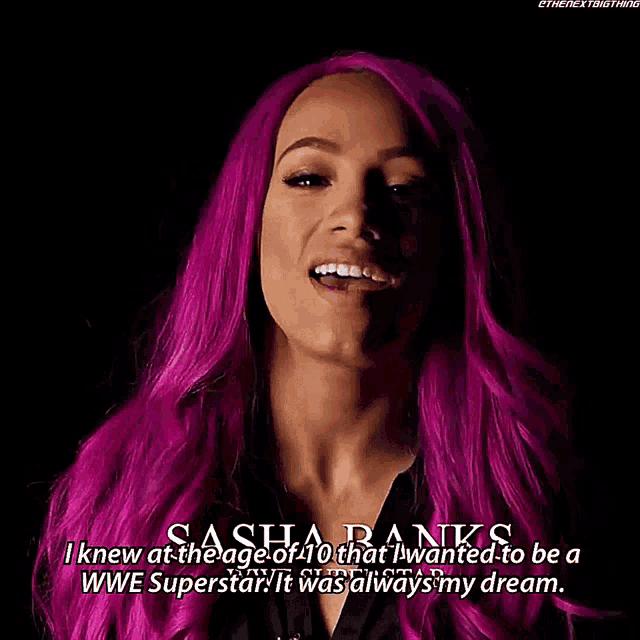 a woman with purple hair says sasha banks
