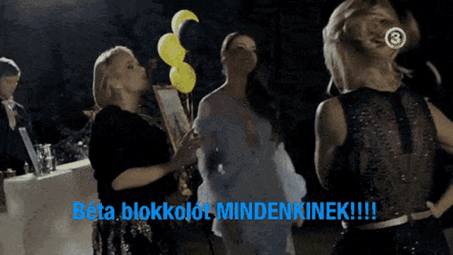 a group of women standing in front of a sign that says beta blokkolt mindenkinek