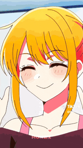 a close up of a girl 's face with a smile on her face .