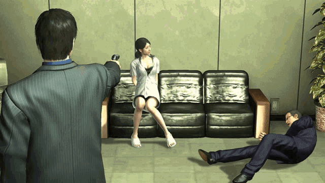 a man pointing a gun at a woman on a couch