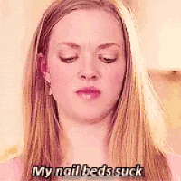 a woman with long blonde hair is making a funny face and says `` my nail beds suck '' .