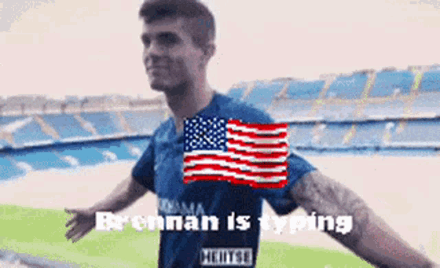 a soccer player in a blue jersey with an american flag on it