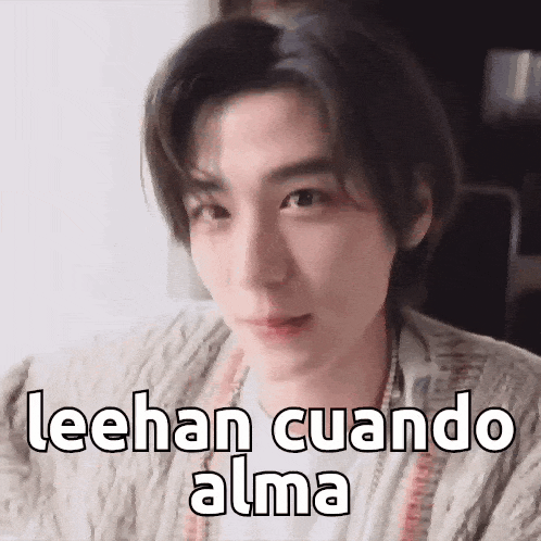 a close up of a person 's face with the words `` leehan cuando alma '' on it .