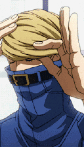 a person is covering their face with their hand