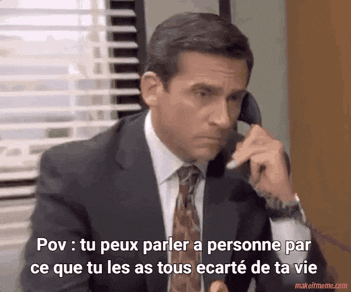 a man in a suit and tie is talking on a phone with the words pov tu peux parler a personne par