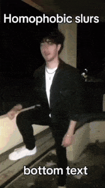 a man in a black jacket is kneeling down with the words homophobic slurs bottom text below him .