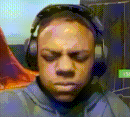 a man wearing headphones with his eyes closed .