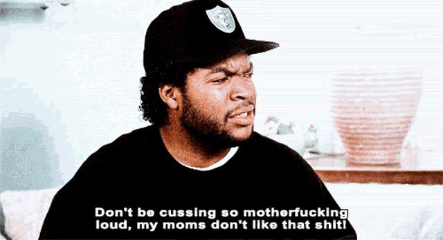 a man wearing a raiders hat says " don 't be cussing so motherfucking loud my moms don 't like that shit