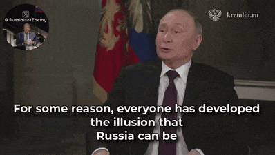 a man in a suit and tie is talking about kremlin.ru