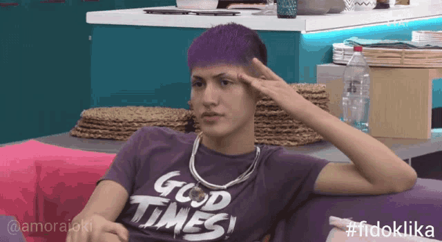 a man with purple hair wearing a purple shirt that says good times