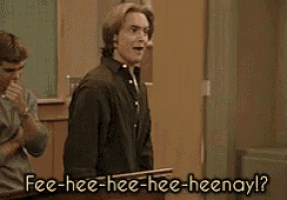 a man in a black shirt is standing in a classroom and says fee-hee-hee-hee-heenay