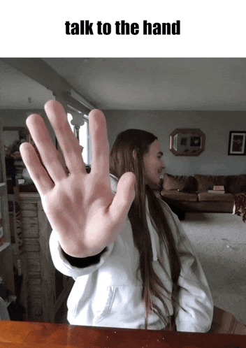a woman giving a high five with the words talk to the hand below