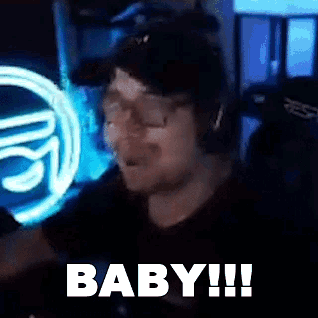 a man wearing a hat and glasses is making a funny face and says baby !!!