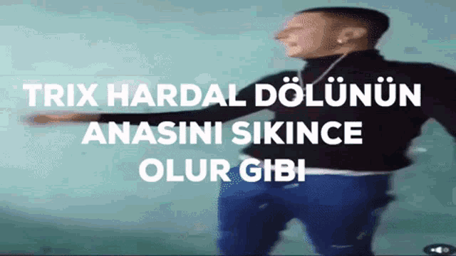 a man in a black shirt is dancing with the words trix hardal dolunun anasini sikince olur gibi behind him