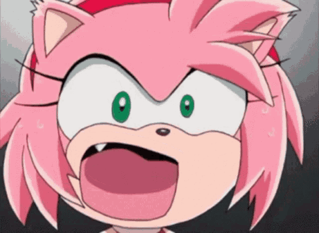 amy rose from sonic the hedgehog is making a funny face with her mouth wide open .