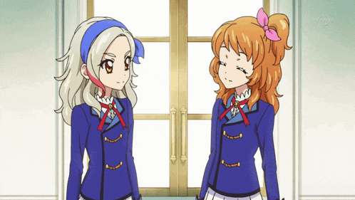 two anime girls are standing next to each other in front of a window that says tokyo on it