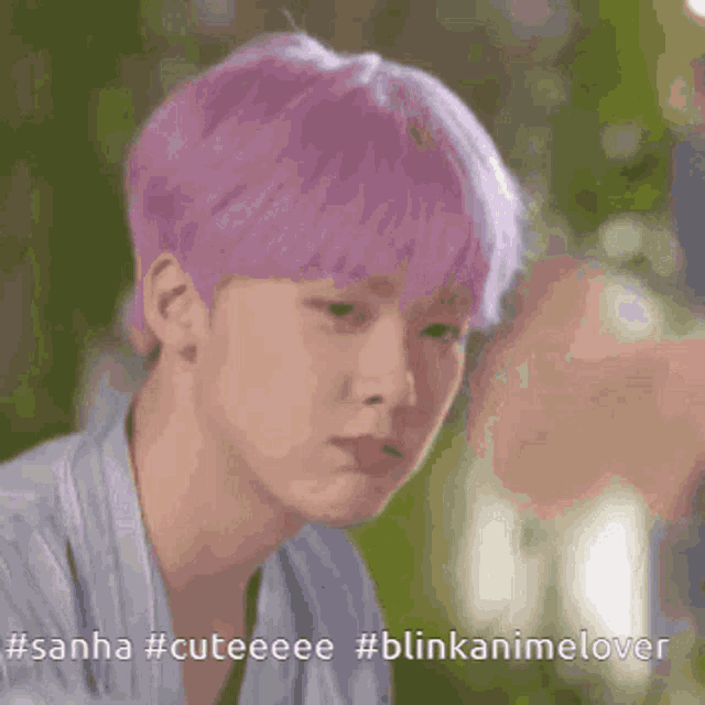 a close up of a person with purple hair and the words #sanha #cuteeee #blinkanimelover