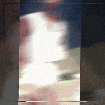 a blurry picture of a person in a white dress is displayed