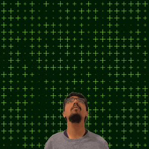 a man stands in front of a green background with the number 21 in yellow