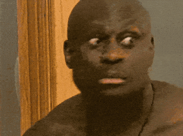 a close up of a man 's face with a brown background