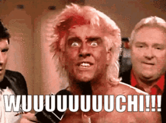 a man with blood on his face is talking into a microphone with the words wuuuuuuuchi !!! written below him