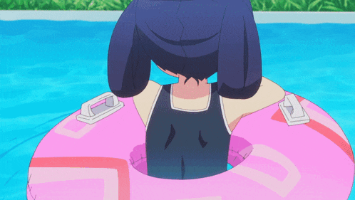 a girl in a swimsuit is floating on a pink float in the water