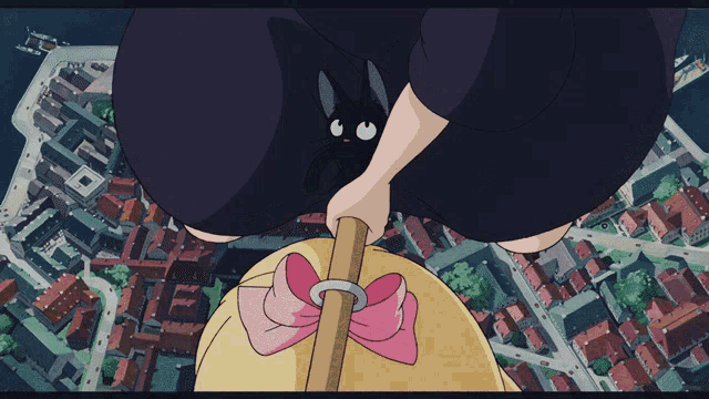 a witch with a black cat on her broomstick
