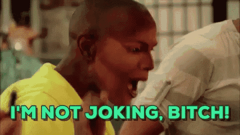 a man in a yellow shirt is screaming and says i 'm not joking bitch .