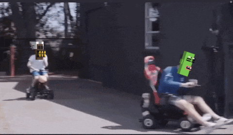 a person is riding a lawn mower with a robot head on it