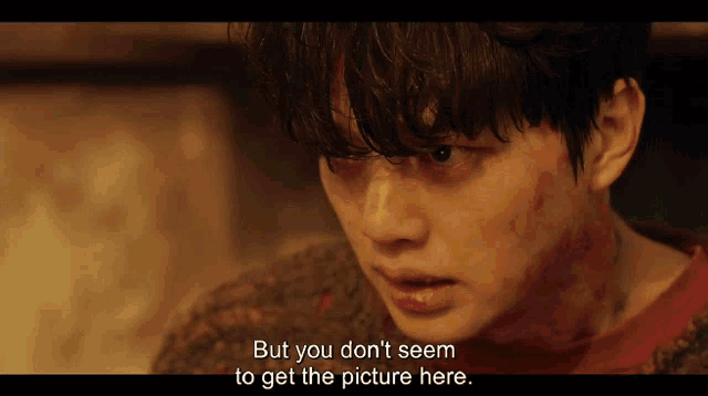 a man with blood on his face and the words but you don 't seem to get the picture here