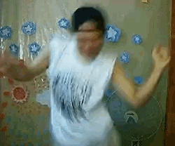 a blurry picture of a person dancing in front of a wall with stars