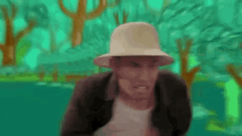 a man wearing a hat and a jacket is standing in front of a green background .