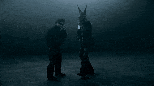 a silhouette of a person in a mask with horns