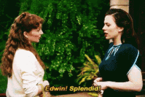 two women are standing next to each other and one of them is saying edwin ! splendid !