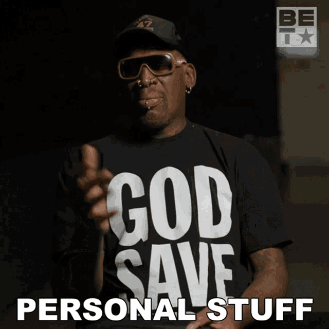 a man wearing a black shirt that says " god save personal stuff "