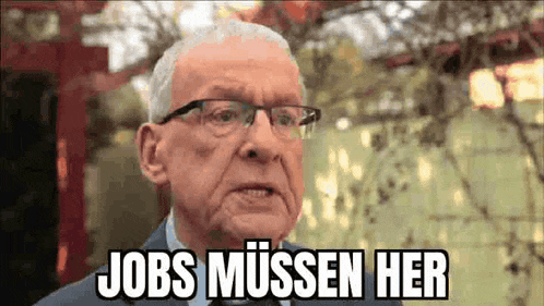 an older man wearing glasses and a suit says jobs mussen her .